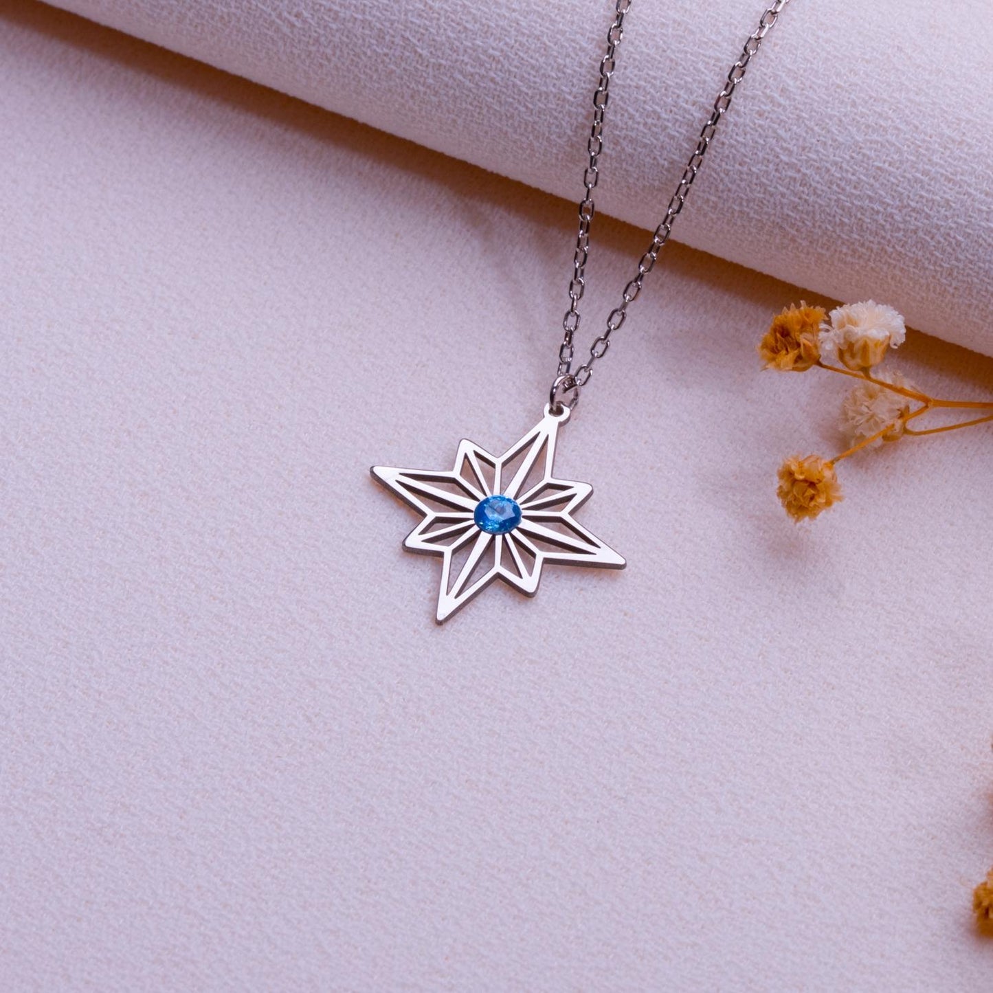 Silver Eight Point Star Necklace with Blue Gemstone Pendant