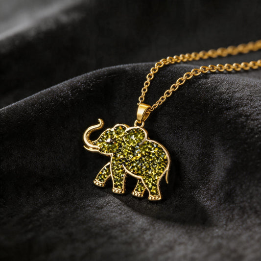 Close-up of handmade Peridot Elephant Necklace | 925 Sterling Silver Animal Jewelry | Minimal Nature Inspired Design | August Birthstone Gift