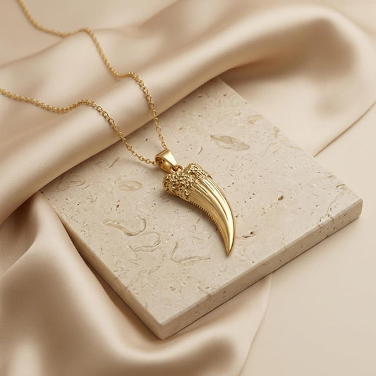 Homotherium Fang jewelry design featured in the Rimossa meaning guide