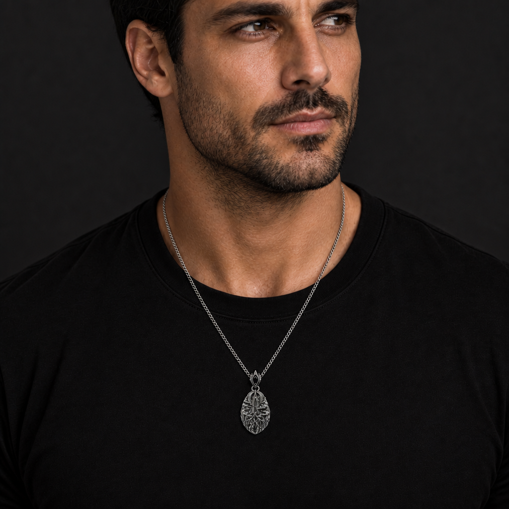 Oxidized 925 sterling silver pendant necklace with a pointed moonspire relief, root-like lower forms, drifting fog bands, and curb chain on a dark background.