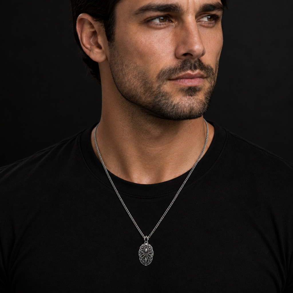 Oxidized 925 sterling silver pendant necklace with curb chain, raised oval memory-core center, root-like relief details, flowing mist shapes, and antique dark finish.