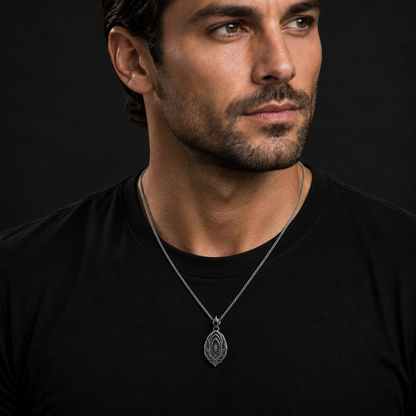 Oxidized 925 sterling silver men's pendant necklace with nested arch relief, flowing wave grooves, pointed silhouette, decorative bail and curb chain on a dark background.