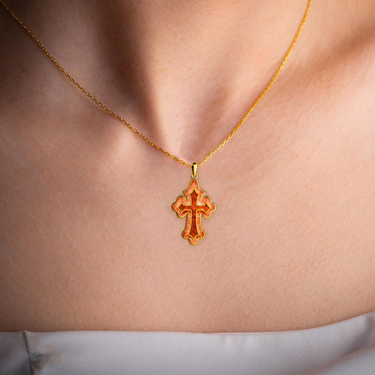 Close view of the Coral Cross Necklace worn at the collarbone