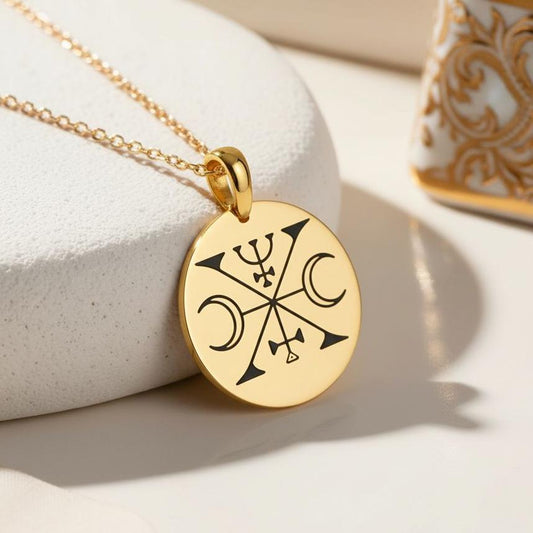 Close-up of a Gold Plated Silver Decarabie Sigil Necklace with round pendant on a white pedestal
