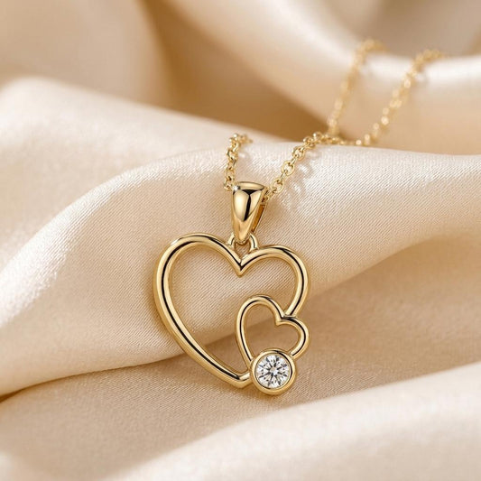 Gold Plated Silver Mother Daughter Heart Necklace close-up on champagne satin