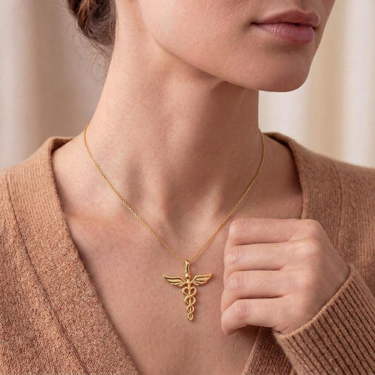 Gold Plated Silver Caduceus Necklace worn with a neutral knit cardigan
