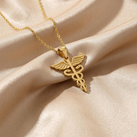 Gold Plated Silver Caduceus Necklace with winged staff pendant on champagne satin