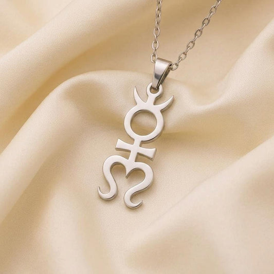 Close-up of the Silver Mithras pendant on cream satin showing the open circular center and curled lower details