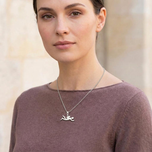 handmade diver necklace worn with a mauve crewneck top